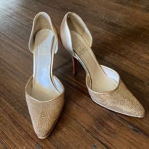 Christian Louboutin upcycled bronze d’orsay heels.